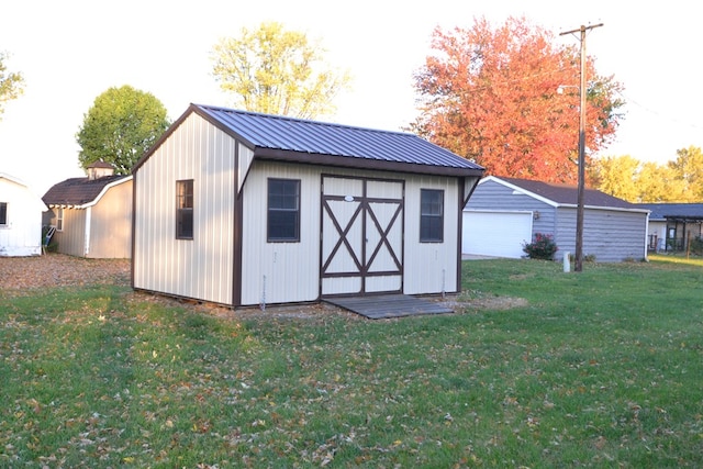 view of outdoor structure with a yard