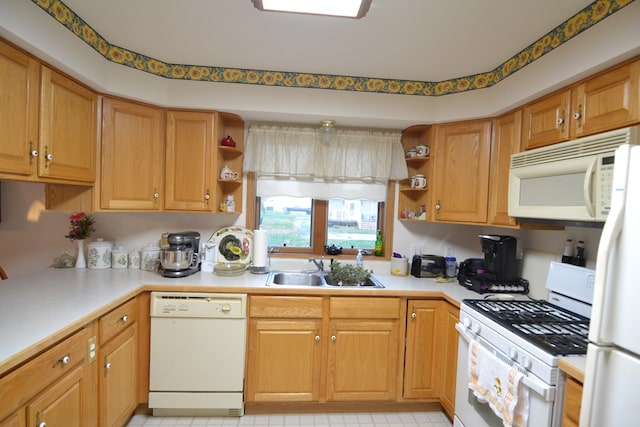 kitchen featuring sink and white appliances