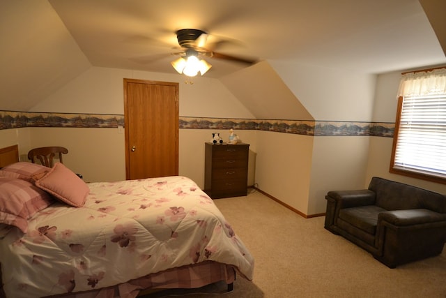 bedroom with ceiling fan and light carpet