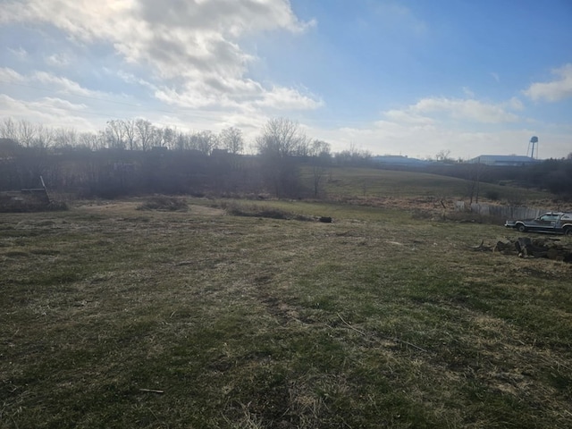 view of yard with a rural view