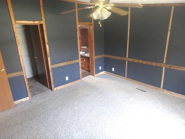 unfurnished bedroom with carpet floors, ensuite bathroom, and a closet