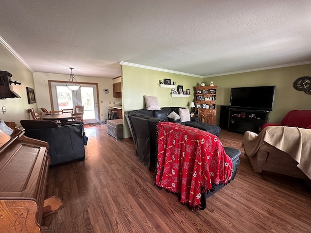 living room with a textured ceiling, dark hardwood / wood-style floors, and crown molding