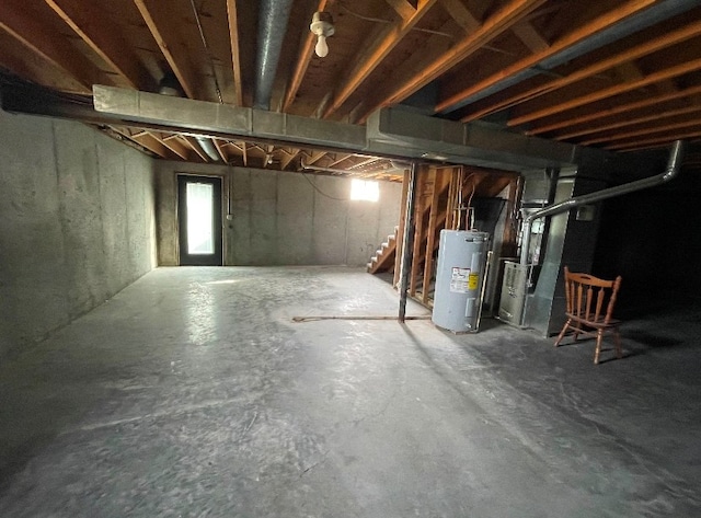 basement with heating unit and electric water heater