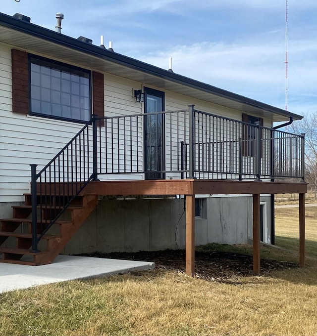 back of house featuring a wooden deck