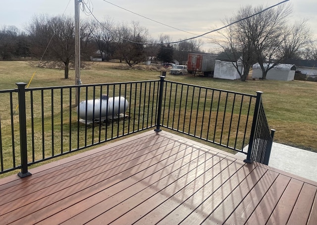 wooden terrace with a lawn