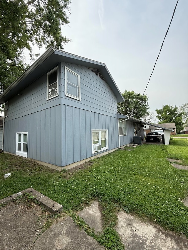 1205 Randolph St, Kirksville, MO 63501 - view of property exterior featuring a lawn and board and batten siding