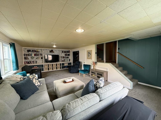 1205 Randolph St, Kirksville, MO 63501 - living area featuring built in shelves, carpet floors, and stairs