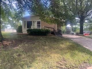 view of home's exterior featuring a yard