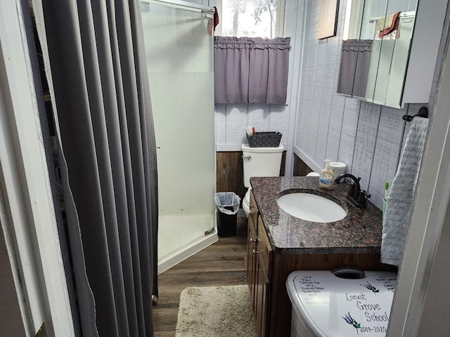 bathroom featuring hardwood / wood-style floors, vanity, and toilet