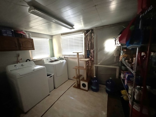 104 Conkle, Brashear, MO 63533 - washroom with cabinet space, washer and dryer, and light tile patterned floors