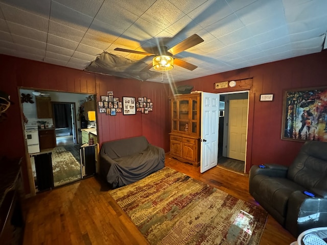 104 Conkle, Brashear, MO 63533 - living room with a ceiling fan, wood finished floors, and wood walls