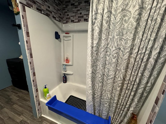 104 Conkle, Brashear, MO 63533 - full bath with wood finished floors and shower / tub combo with curtain