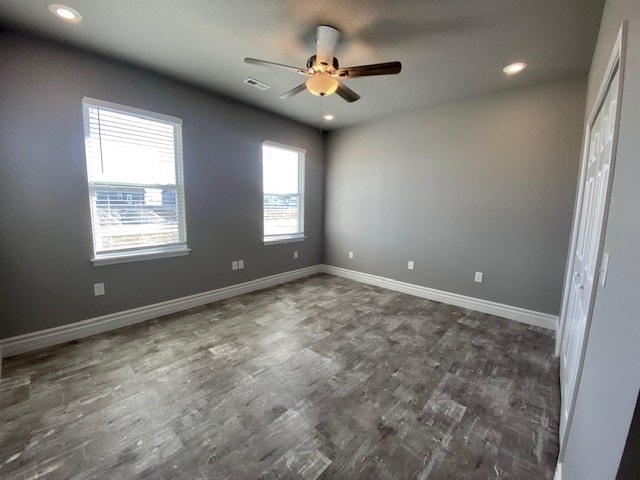 spare room with ceiling fan