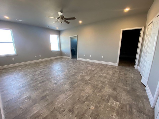 unfurnished room with ceiling fan