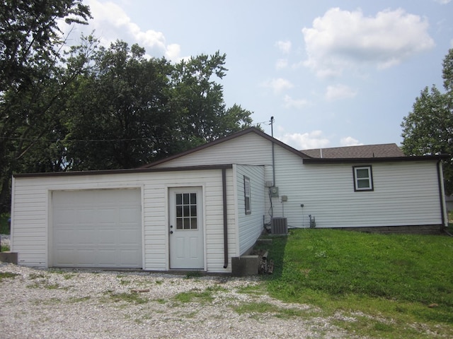 exterior space featuring a garage and central AC unit