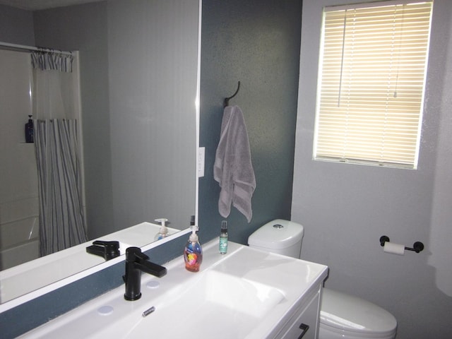 full bathroom featuring vanity, toilet, and shower / bathtub combination with curtain