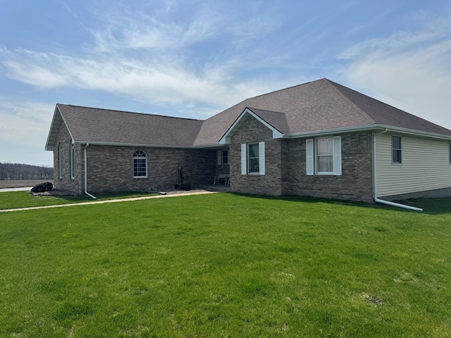 14695 Motter Hill Rd, Kirksville, MO 63501 - view of front of home with brick siding, a front lawn, and a shingled roof
