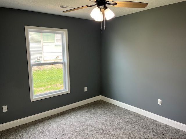 1216 N Franklin St, Kirksville, MO 63501 - carpeted spare room featuring baseboards, a ceiling fan, and a textured ceiling