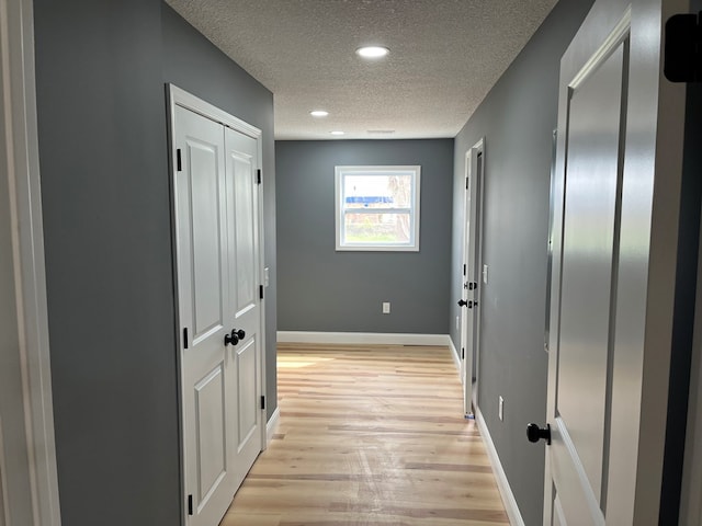 1216 N Franklin St, Kirksville, MO 63501 - hallway featuring baseboards, light wood finished floors, recessed lighting, and a textured ceiling