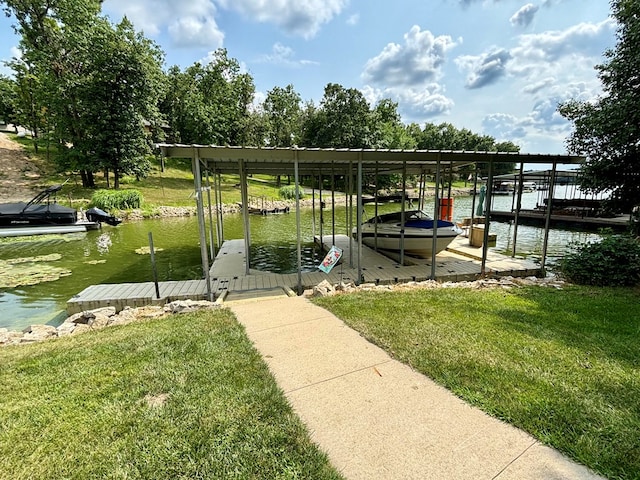 view of dock with a water view and a yard