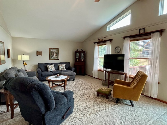 living room featuring light colored carpet, high vaulted ceiling, and a wealth of natural light