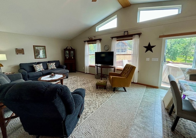 living room with lofted ceiling with beams