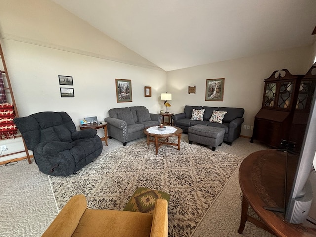 living room with carpet floors and vaulted ceiling