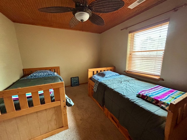 carpeted bedroom with ceiling fan and wooden ceiling