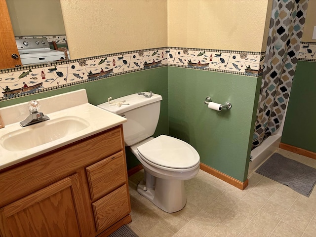 bathroom with a shower with shower curtain, vanity, toilet, and tile patterned floors