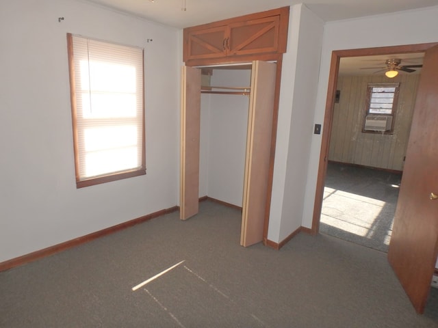 unfurnished bedroom with carpet and a closet