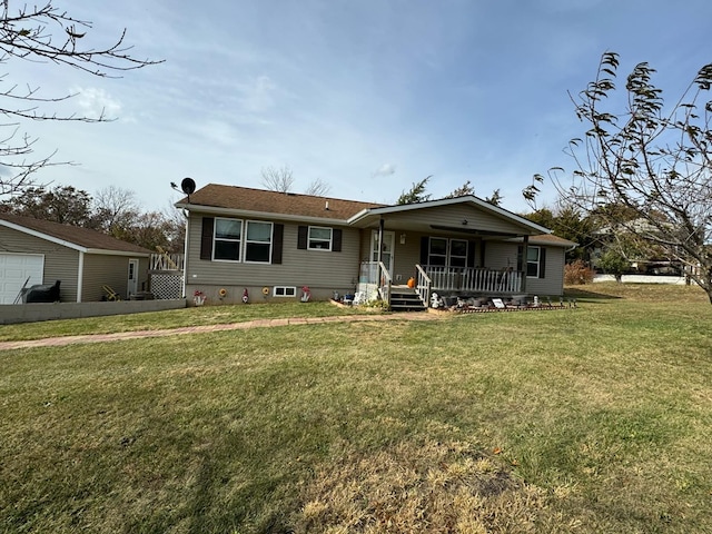 view of front facade with a front lawn and covered porch