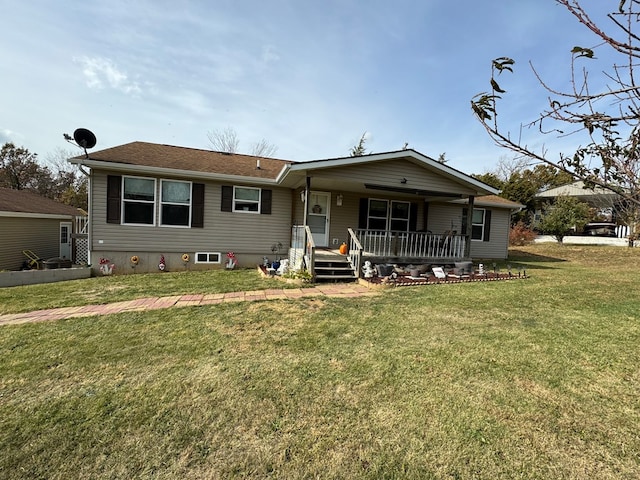 view of front of home with covered porch and a front lawn