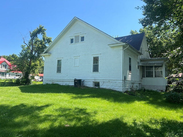 110 Van Buren St, Browning, MO 64630 - view of home's exterior with a sunroom and a lawn