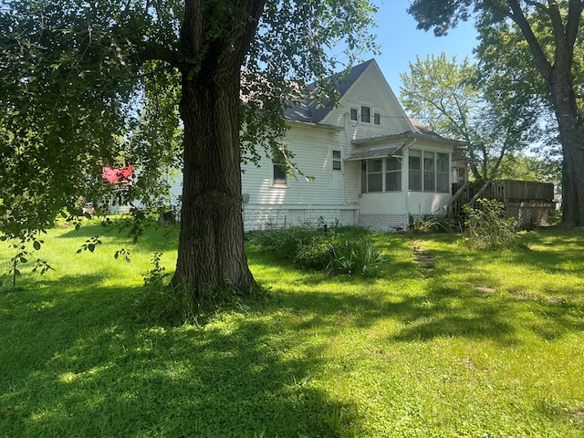 110 Van Buren St, Browning, MO 64630 - back of house with a sunroom and a yard