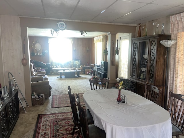 110 Van Buren St, Browning, MO 64630 - dining space featuring carpet flooring, a drop ceiling, and wood walls