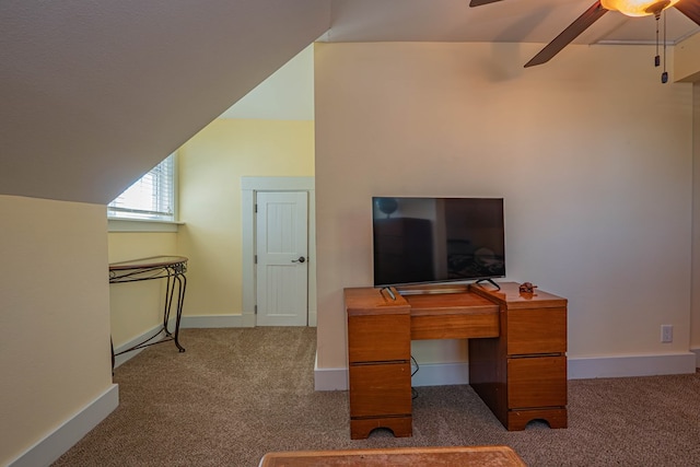 carpeted office with vaulted ceiling and ceiling fan