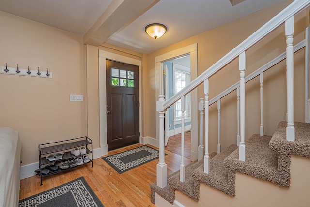 foyer entrance with hardwood / wood-style flooring