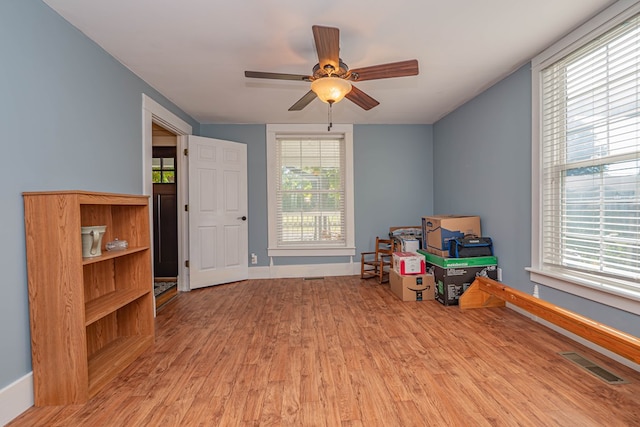 miscellaneous room with light hardwood / wood-style floors and ceiling fan