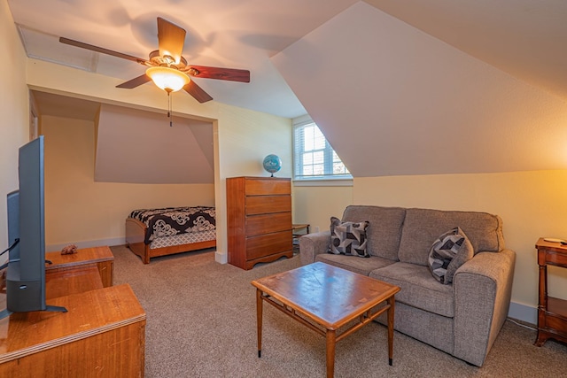 living room with ceiling fan, light colored carpet, and vaulted ceiling