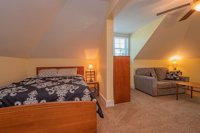 carpeted bedroom with ceiling fan and lofted ceiling