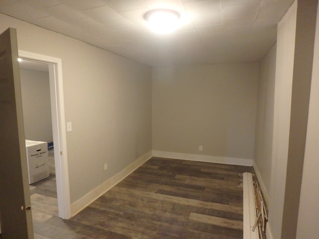 spare room featuring dark hardwood / wood-style floors