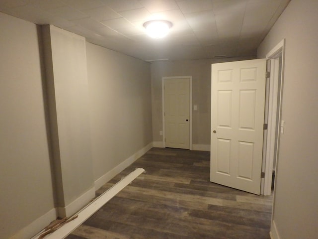 hallway featuring dark wood-type flooring