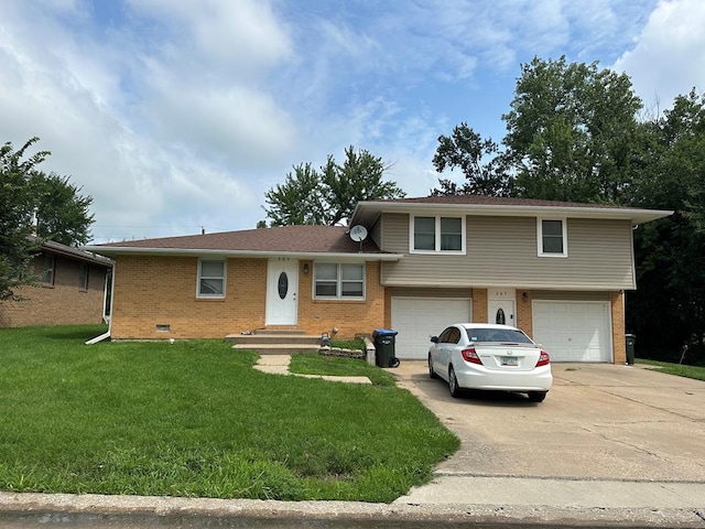 tri-level home featuring brick siding, an attached garage, concrete driveway, and a front yard