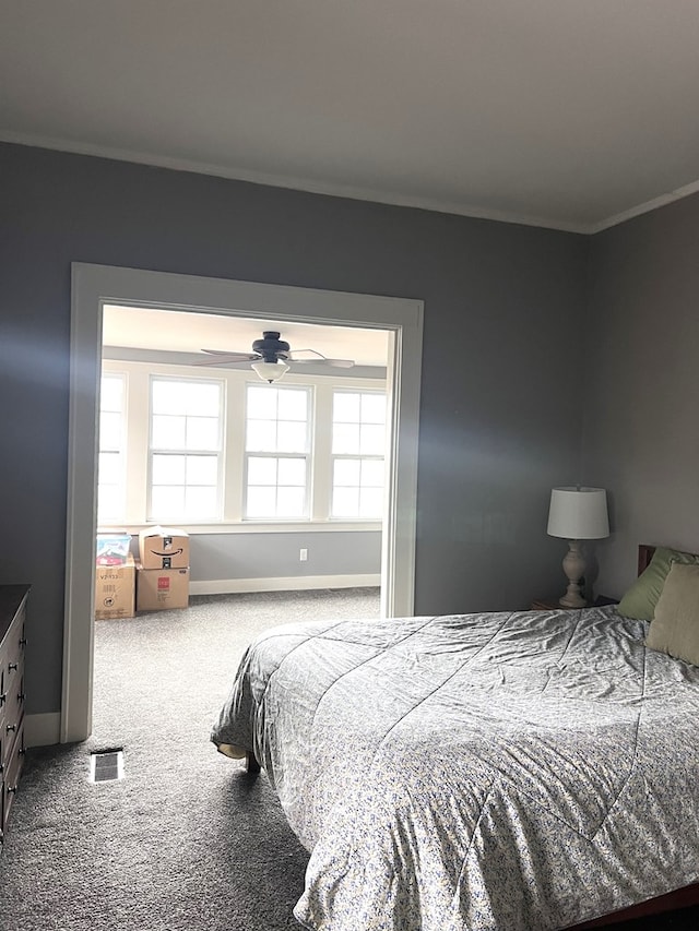 carpeted bedroom featuring ornamental molding