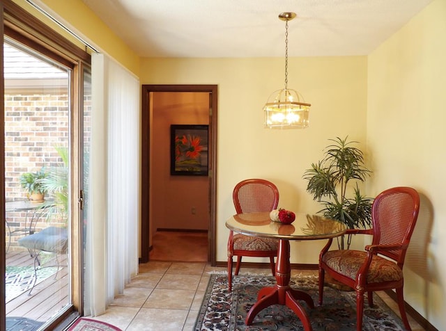 sitting room with light tile patterned flooring and a notable chandelier