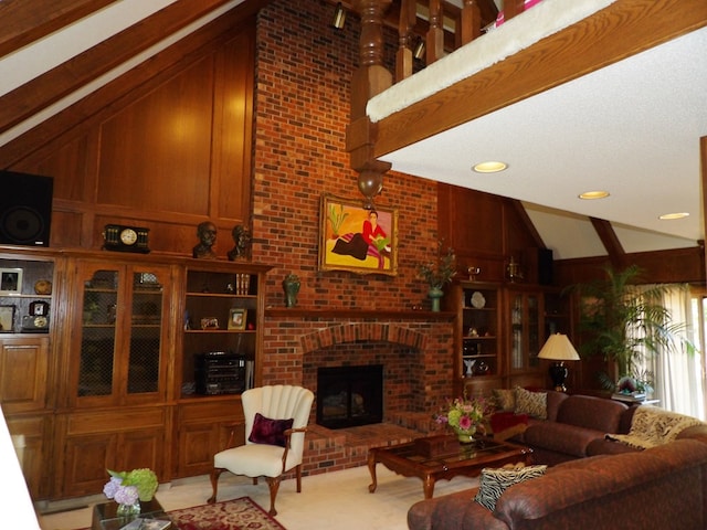 living room featuring high vaulted ceiling, wooden walls, and a brick fireplace