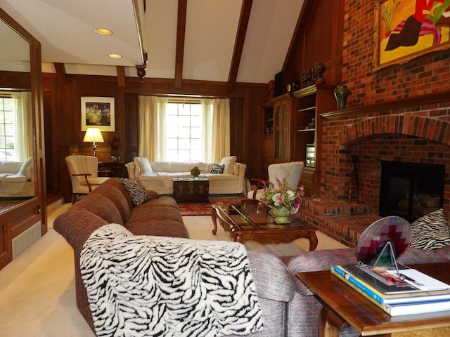 living room featuring vaulted ceiling with beams, a brick fireplace, and wooden walls