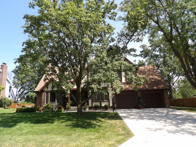 view of front of house with a front lawn and a garage