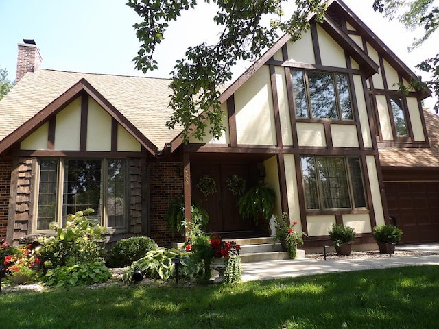 rear view of house with a garage