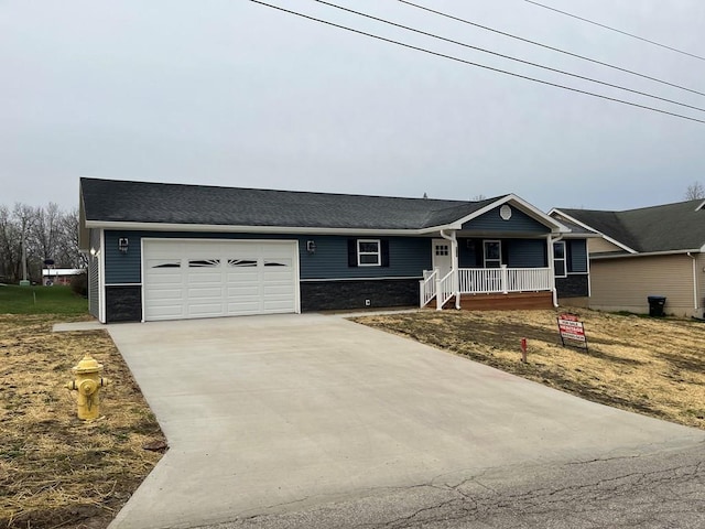 506 E Mill St, Kirksville, MO 63501 - ranch-style home featuring covered porch, driveway, and a garage